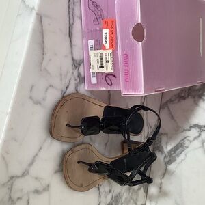 Miu Miu Black Patent Leather T-Strap Sandals with Geometric Embellishments